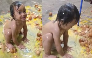 Seorang Kanak-Kanak Perempuan ‘Bermandikan’ Telur.